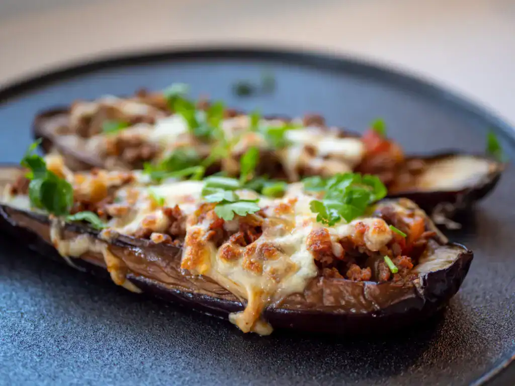 Traditional food stuffed eggplant, meat, tomato and spices, karniyarik