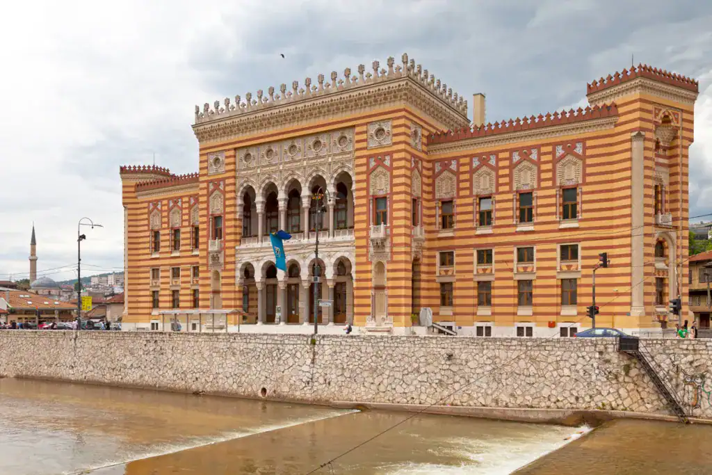 Sarajevo, Bosnia and Herzegovina - May 26 2019: The Sarajevo City Hall, known as Vijećnica, was designed in 1891 by the Czech architect Karel Pařík. It was initially the largest and most representative building of the Austro-Hungarian period in Sarajevo and served as the city hall.